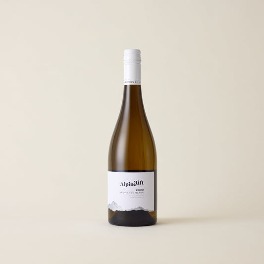 White wine bottle with Sauvignon Blanc wine inside. A white label with Alpine Rift logo. A white screwtop and neck label.