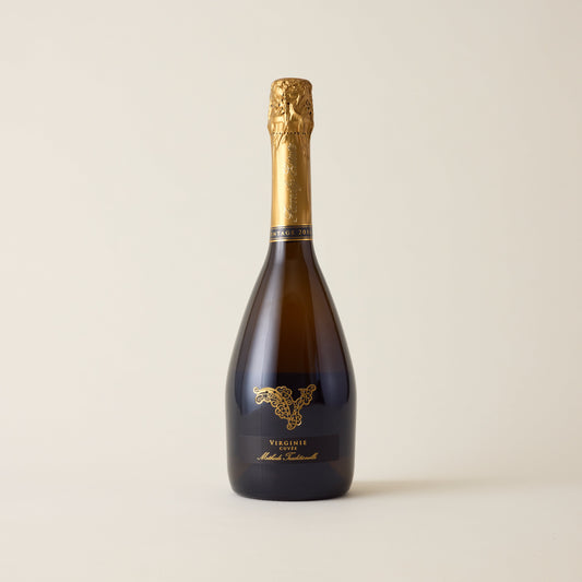 Sparkling wine bottle with Chardonnay wine inside. A Black label with No1 family estate logo. A gold foil cap and neck label.