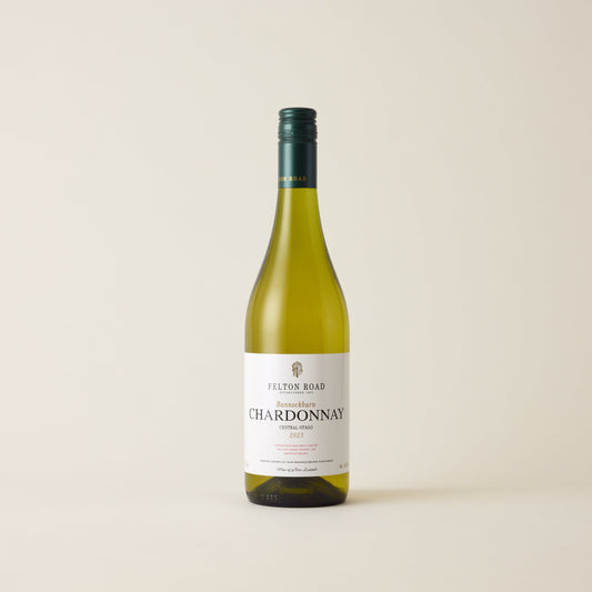 White wine bottle with Chardonnay wine inside. A white label with Felton Road logo. A green screwtop and felton road logo on neck label.