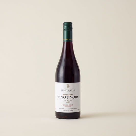 Red wine bottle with Pinot Noir wine inside. A white label with Felton Road logo. A green screwtop and felton road logo on neck label.