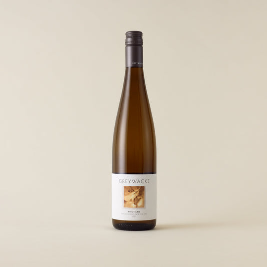 White wine bottle with Pinot Gris wine inside. A white label with Greywacke logo and image of vine. A matte grey screwcap and neck label.