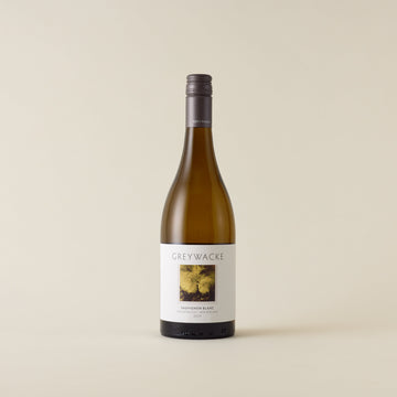 White wine bottle with Sauvignon Blanc wine inside. A white label with Greywacke logo and image of vine leaf. A matte grey screwcap and neck label.