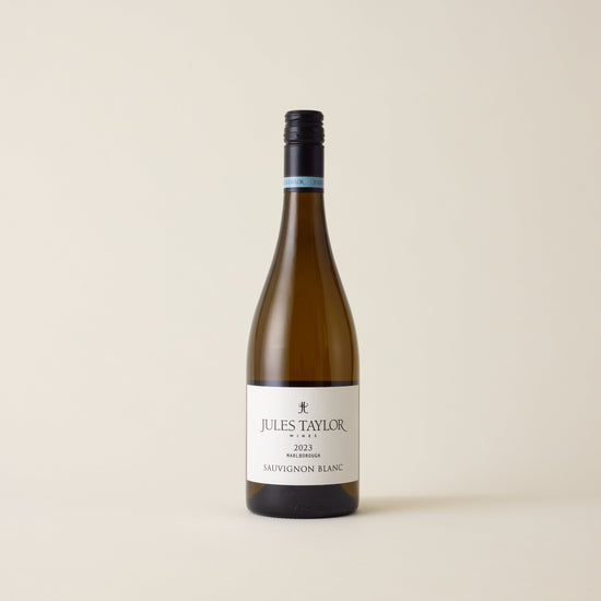 White wine bottle with Sauvignon Blanc wine inside. A White label with Jules Taylor logo. A black screwtop and logo on neck label.