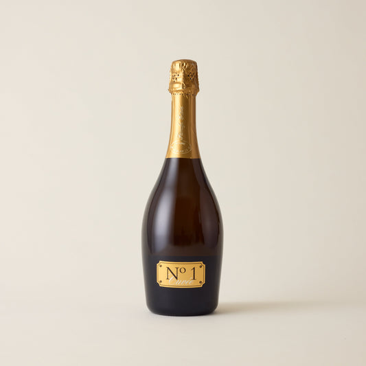 Sparkling wine bottle with Chardonnay wine inside. A Gold label with No1 family estate logo. A gold foil cap and neck label.