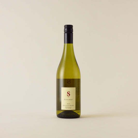 White wine bottle with Sauvignon Blanc wine inside. A cream label with Schubert logo. A black screwcap and neck label.