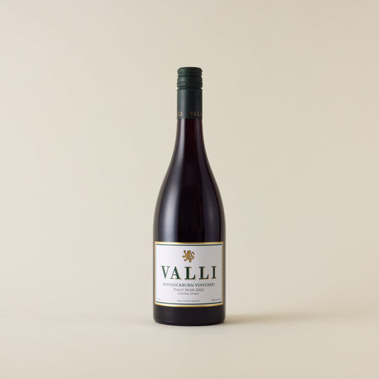 Red wine bottle with pinot noir wine inside. A white label with Valli logo. A forest green screwtop and Valli logo on neck label.