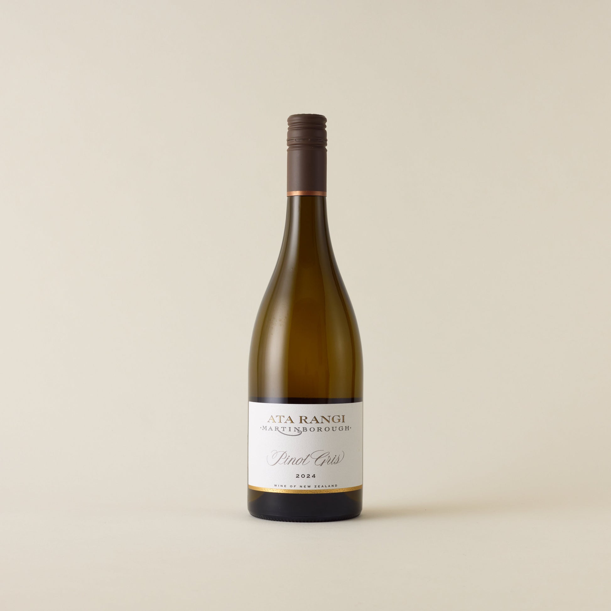 White wine bottle with pinot gris wine inside. A white label with Ata Rangi logo. A brown screwtop and neck label. 