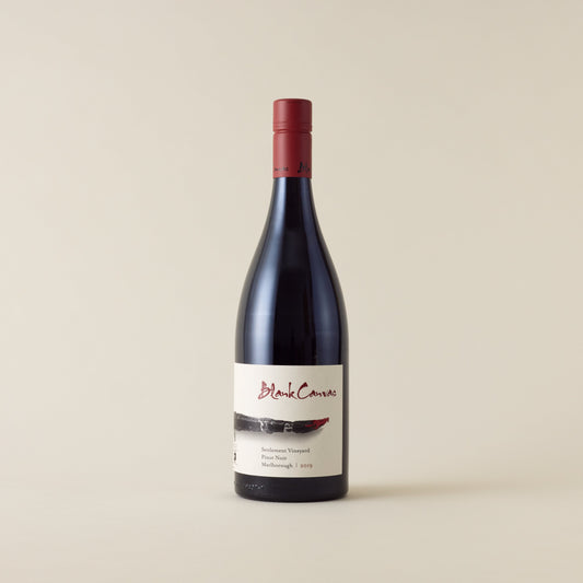Red wine bottle with pinot noir wine inside. A white label with Blank Canvas logo and paint brush design. A red screwtop and neck label.