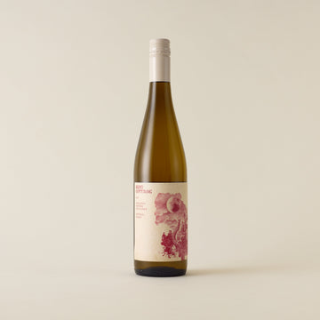 White wine bottle with Riesling wine inside. A cream label with burn cottage logo. A cream screwtop and neck label. 