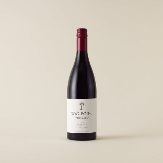 Red wine bottle with pinot noir wine inside. A white label with Dog Point logo. A red screwtop and neck label. 