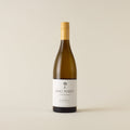 White wine bottle with sauvignon blanc wine inside. A white label with Dog Point logo. A yellow screwtop and neck label. 