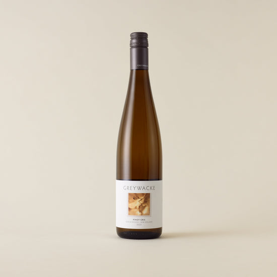 White wine bottle with Pinot Gris wine inside. A white label with Greywacke logo and image of vine. A matte grey screwcap and neck label.