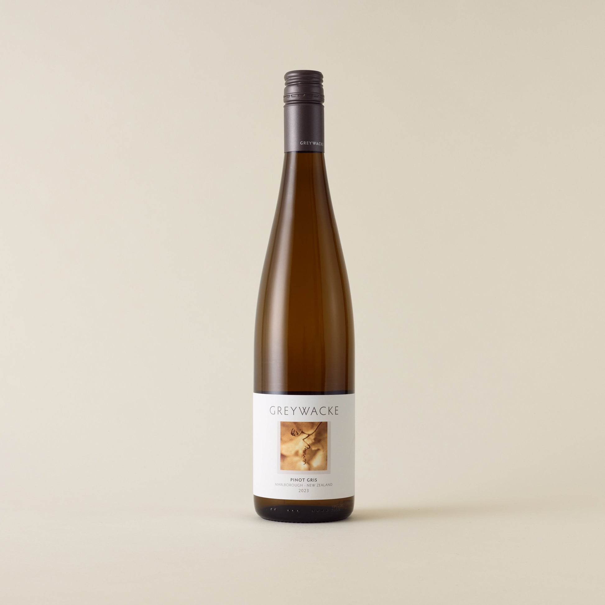 White wine bottle with Pinot Gris wine inside. A white label with Greywacke logo and image of vine. A matte grey screwcap and neck label.