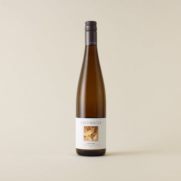 White wine bottle with Pinot Gris wine inside. A white label with Greywacke logo and image of vine. A matte grey screwcap and neck label.