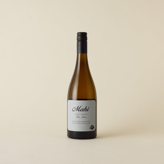 A white wine with sauvignon blanc wine inside. A blue label with Mahi logo and snail design in black. A black screw cap and neck label. 
