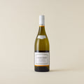 White wine bottle with chardonnay wine inside. A white label with Kumeu Rover logo. A white screwcap and neck label.