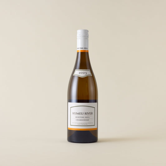 White wine bottle with Chardonnay wine inside. A white label with Kumeu River logo. A white screwcap and neck label.