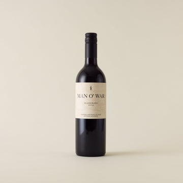Red wine bottle with malbec and merlot wine inside. A cream label with Man O War logo. A black screwcap and neck label.