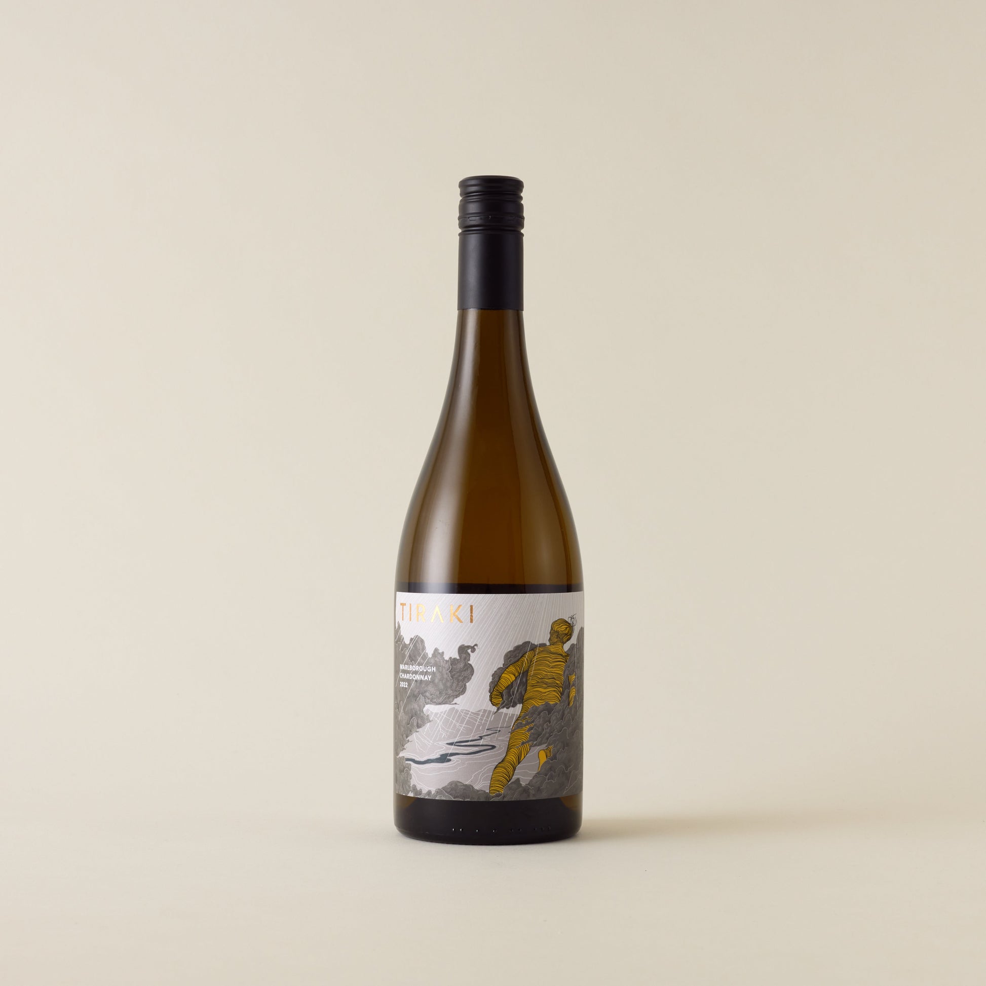 White wine bottle with chardonnay wine inside. A grey label with Tiraki logo in gold. A black screwtop and neck label. 