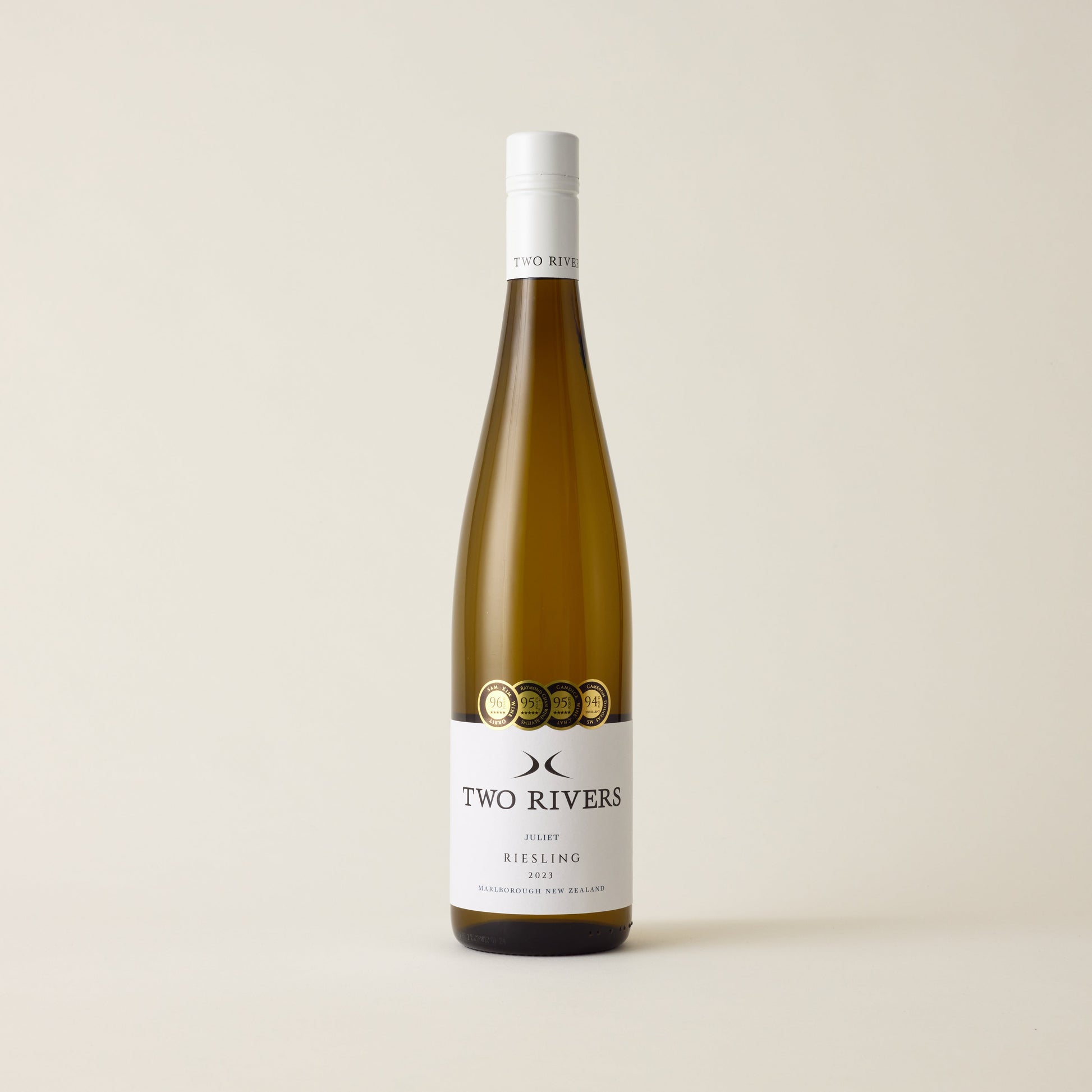 White wine bottle with riesling wine inside. A white label with two rivers logo. A white screwcap and neck label.