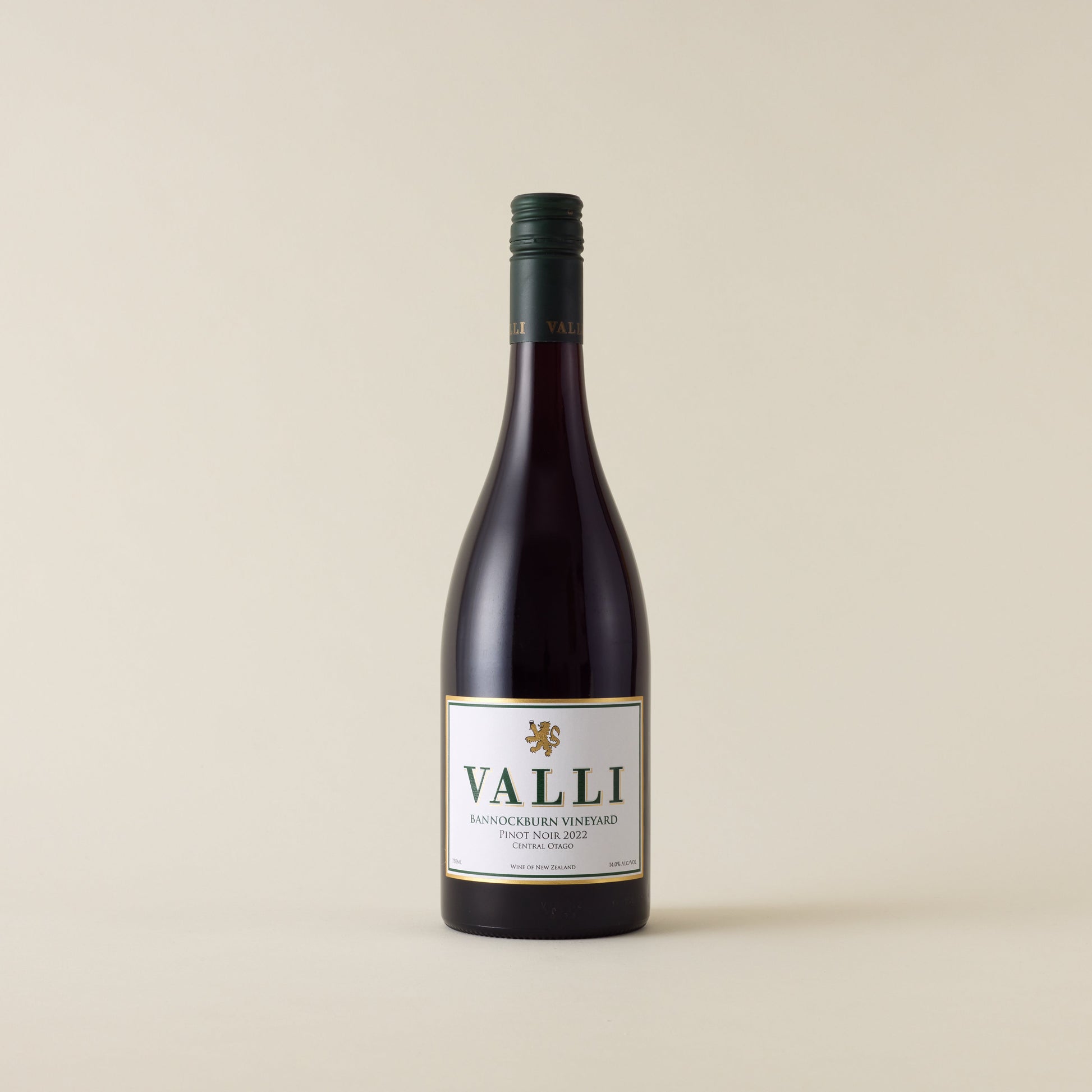 Red wine bottle with pinot noir wine inside. A white label with Valli logo. A forest green screwtop and Valli logo on neck label. 