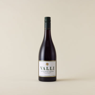 Red wine bottle with pinot noir wine inside. A white label with Valli logo. A forest green screwtop and Valli logo on neck label. 